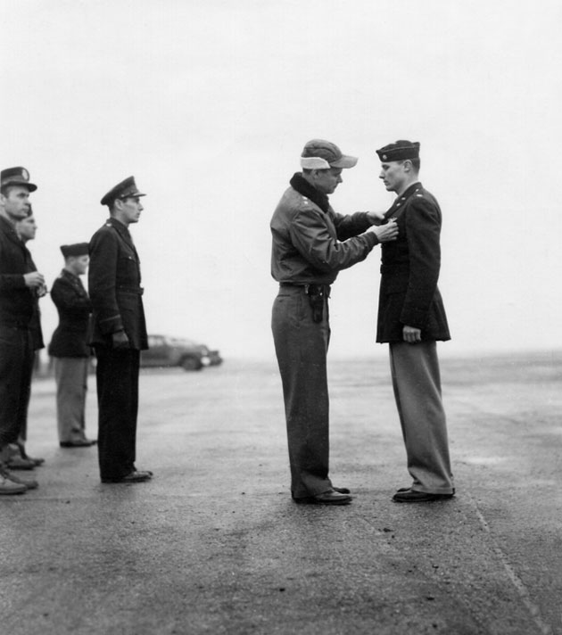 Lt. Col. Delwin Dale Bentley, of Casper, Wyoming, is shown receiving the Distinguished Flying Cross for gallantry.