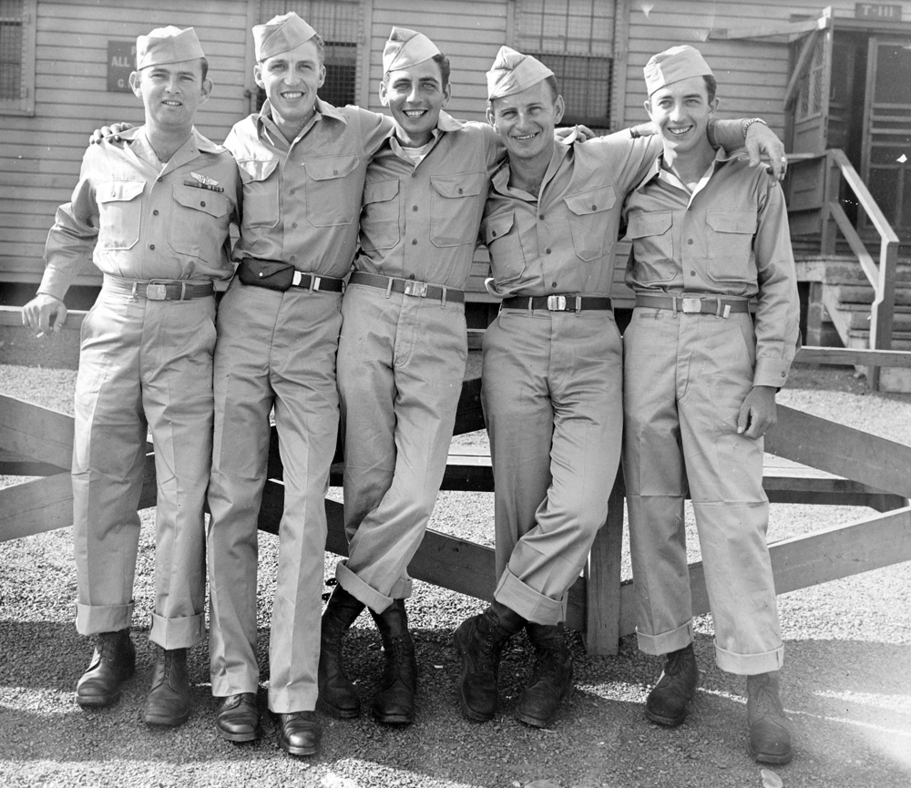 Photo taken at Camp Kilmer, NJ, 8/16/45. Returning heroes of the 555th Bomb Squadron, left to right: Lewis, John Howlett, Guy Cook, Michael Weiss, Leo Quigg.